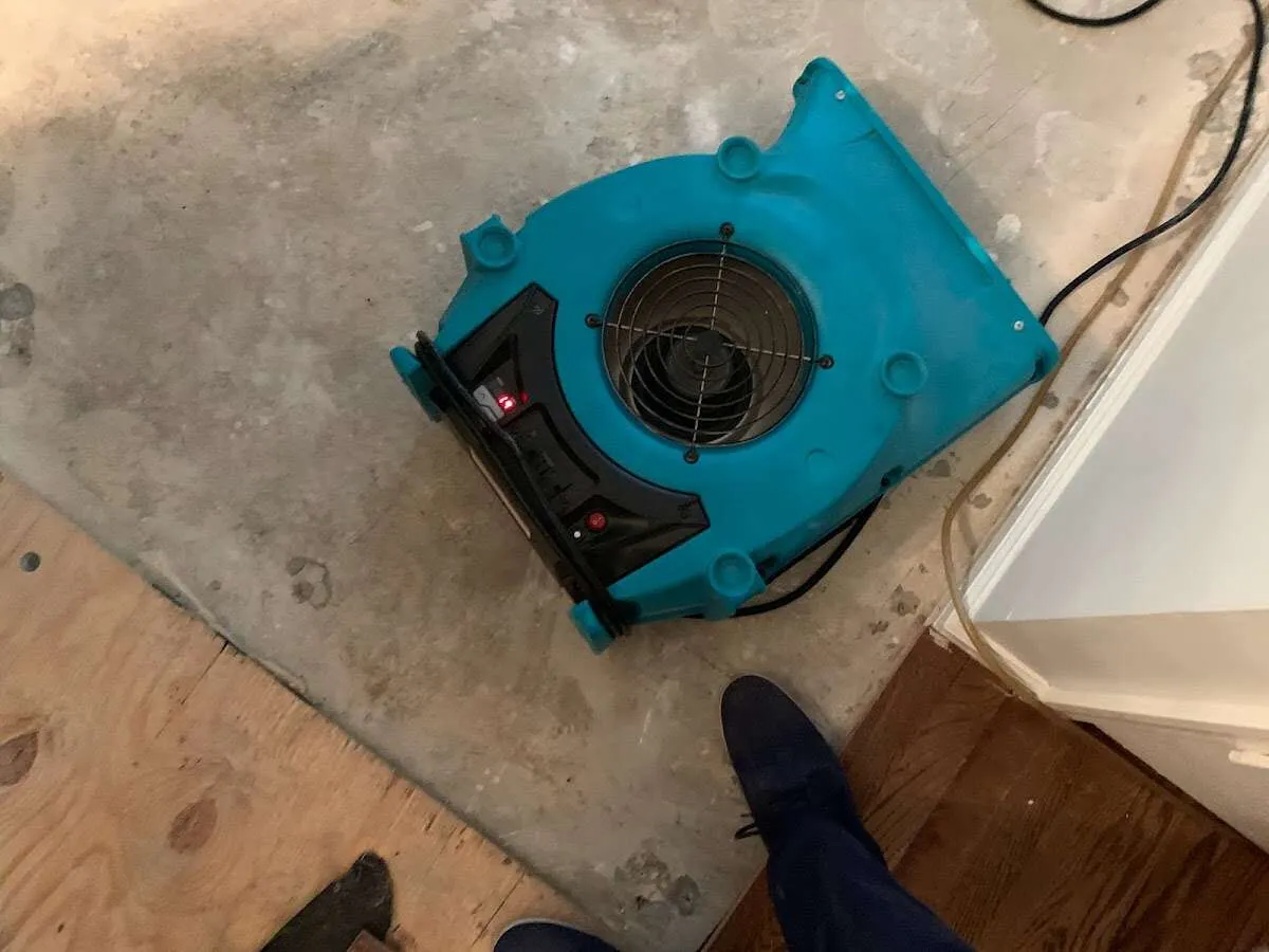 Air mover drying subfloor during Leak Detection & Repair in Druid Hills